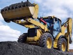 30 років успішного виробництва екскаваторів-навантажувачів від Caterpillar